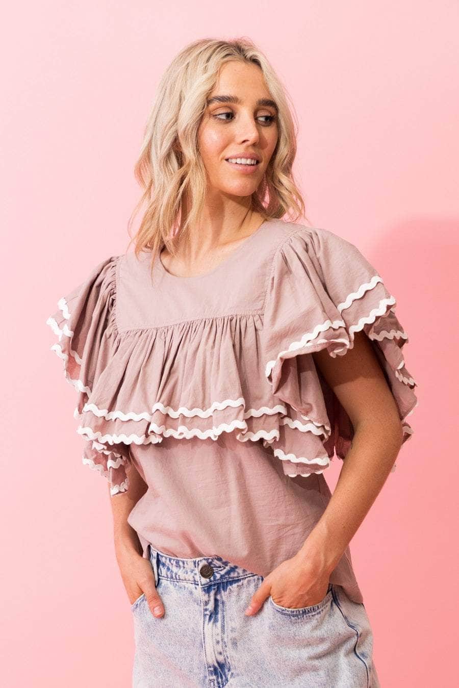 beige brown tan top with layers of gathered frills white trim ric rac