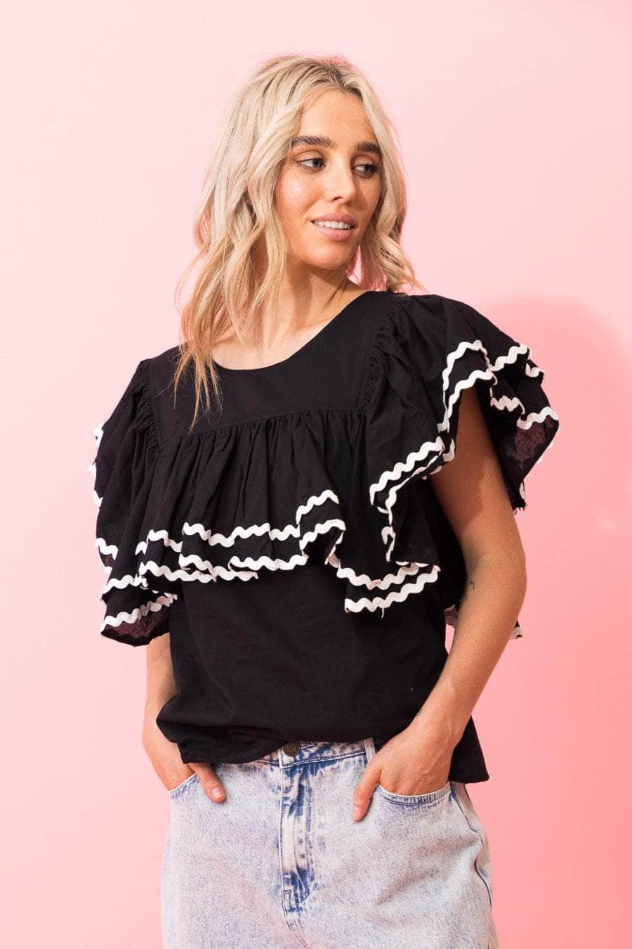 black top with layers of gathered frills white trim ric rac