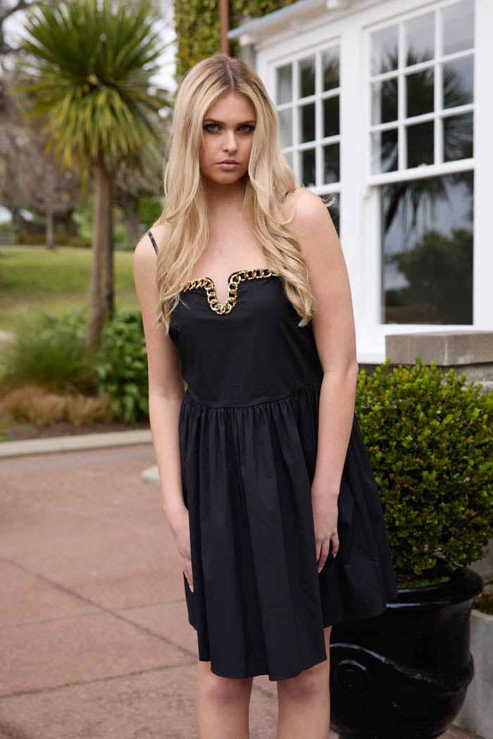 Black mini dress with gold chain