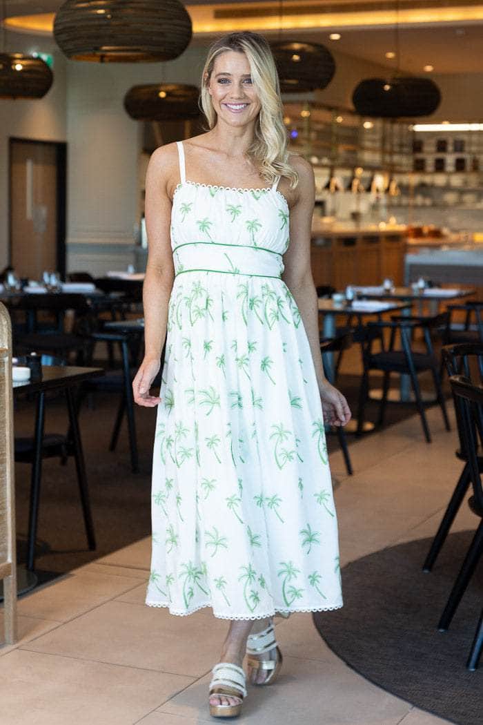 white midi dress with embroidered green palm tree prints