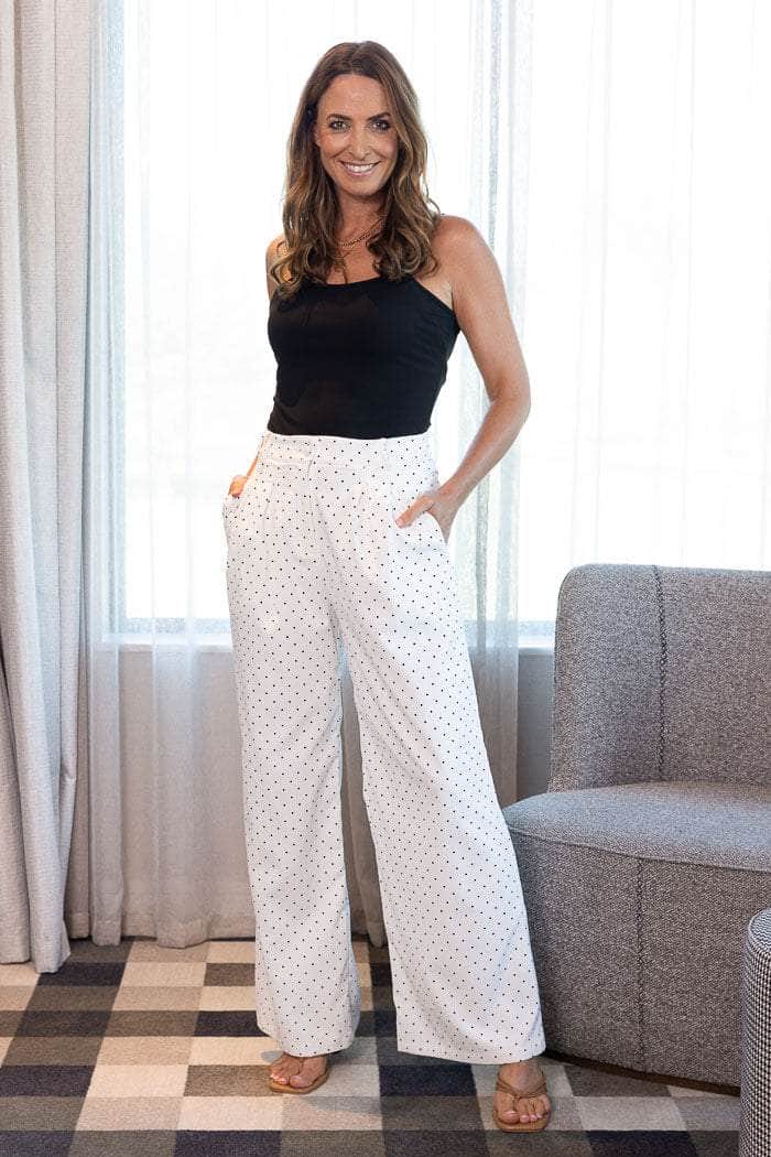 white wide-leg pants with small black polka dots