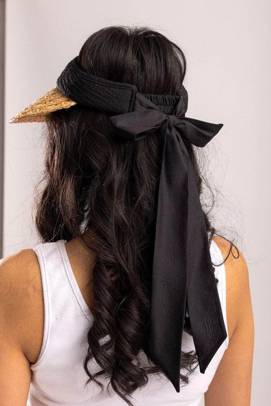 woven tan visor with black trim