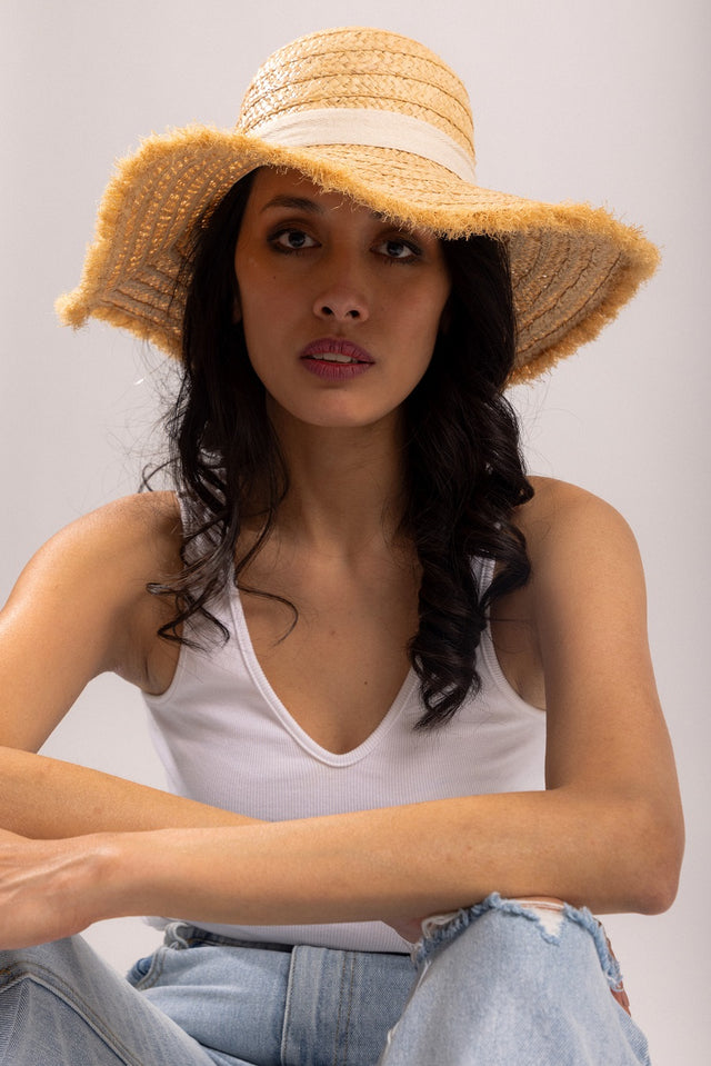 tan woven summer hat with white bow