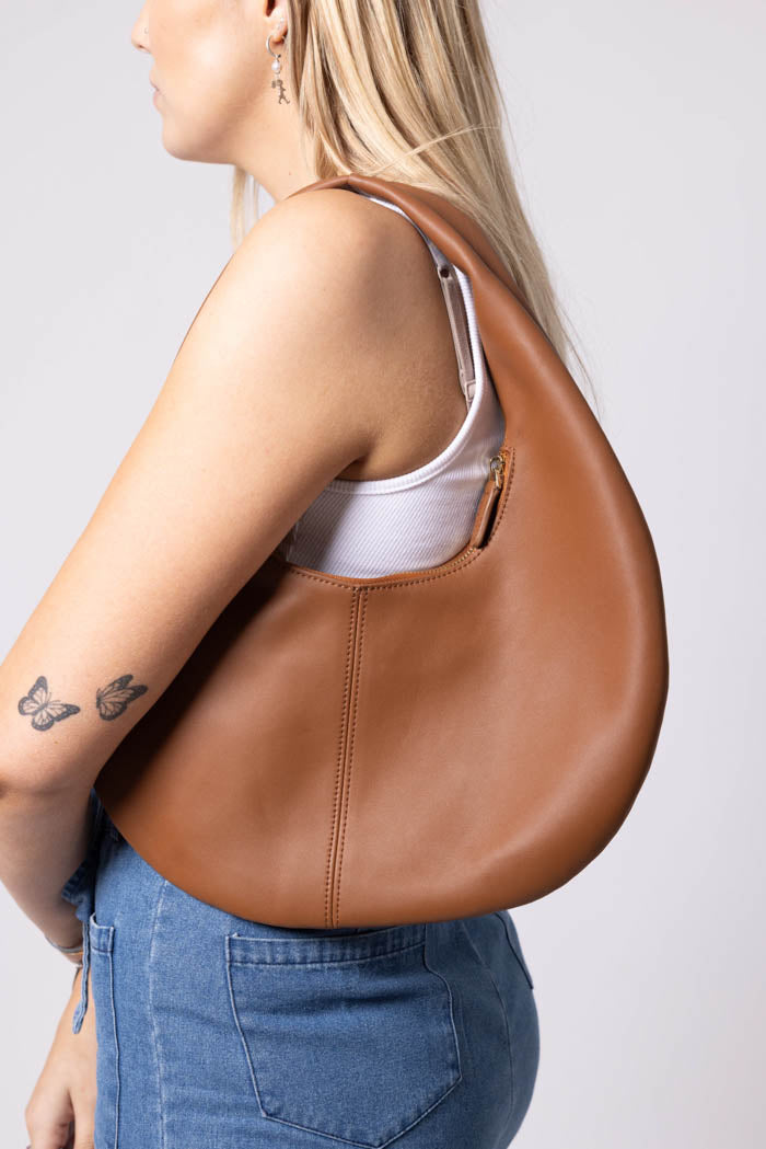 brown circle leather handbag