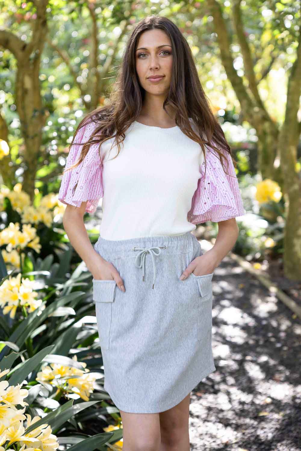 white top pink sleeves