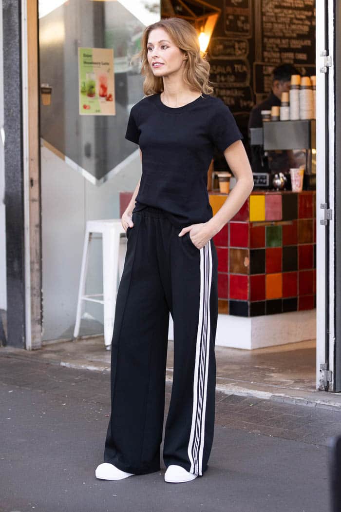 black wide leg trackpant with white side stripes