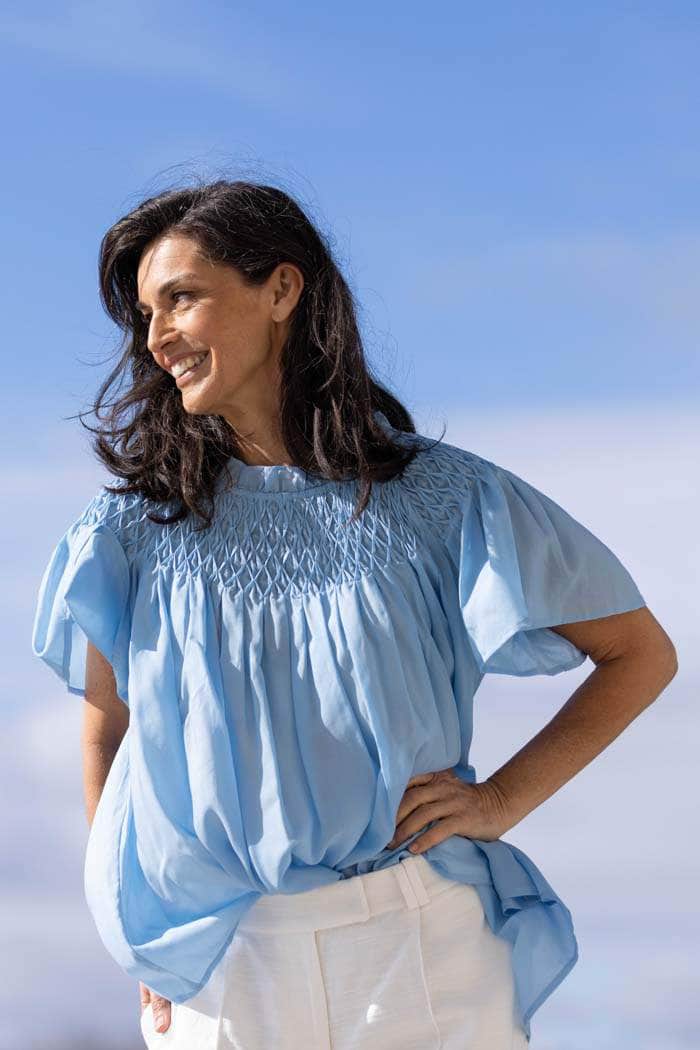 blue smocked blouse
