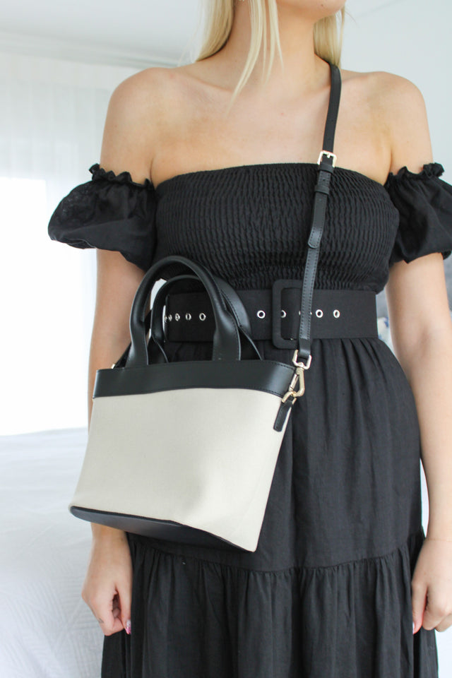 Cream canvas handbag with black straps