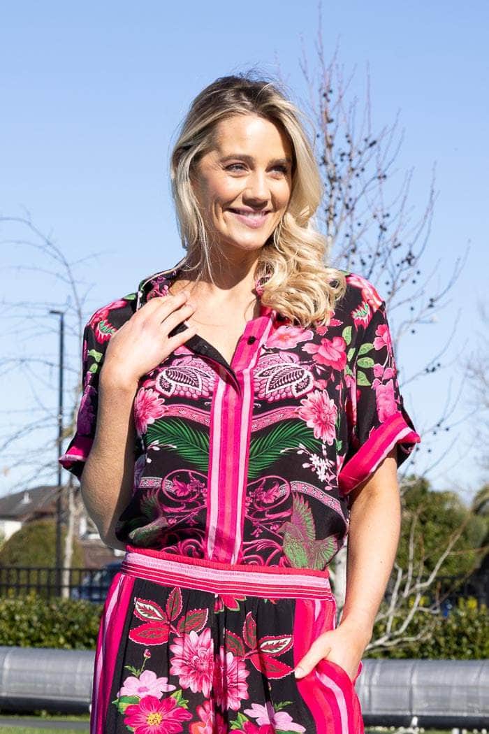 vibrant pink and black floral print shirt