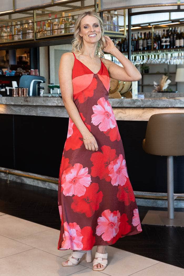 sleeveless maxi dress with a red and pink floral print