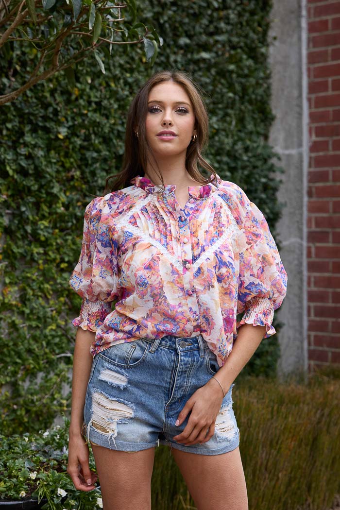 Floral and white trim top