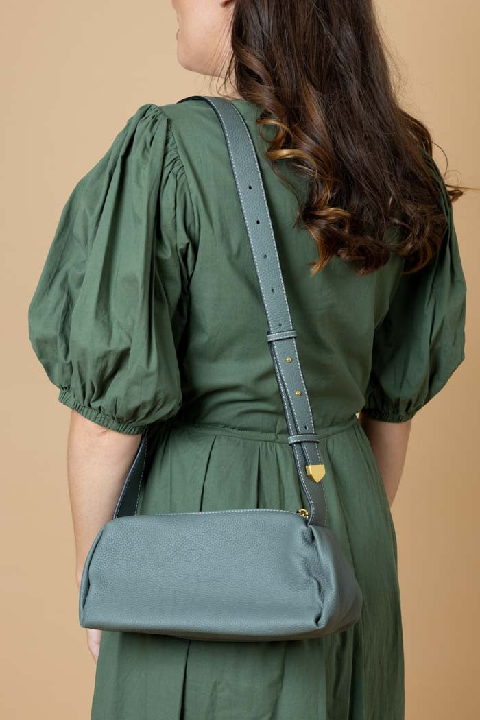 green leather handbag