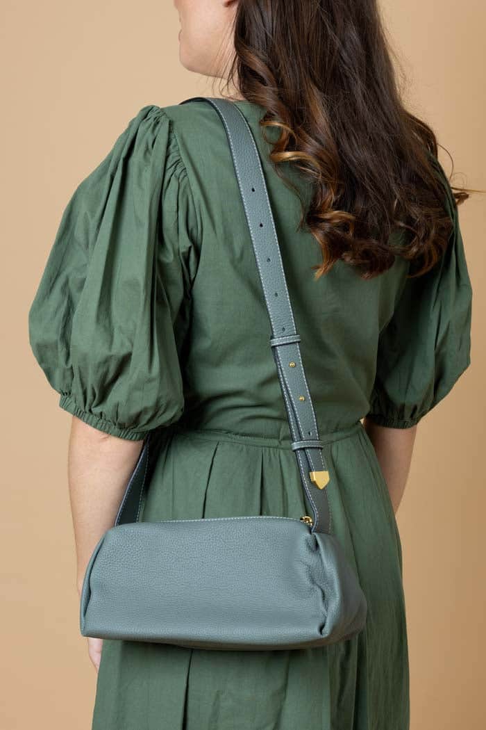 green leather handbag