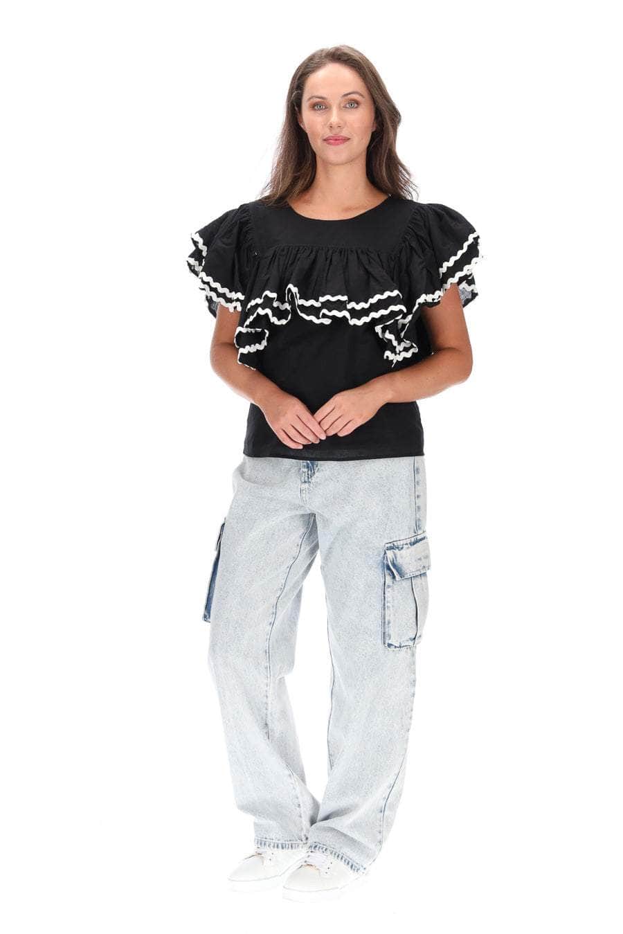 black top with layers of gathered frills white trim ric rac