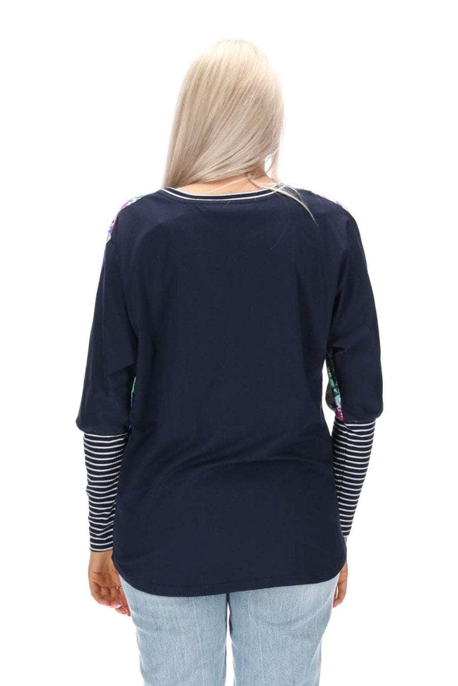 A blue floral print top with a navy back striped ribbing