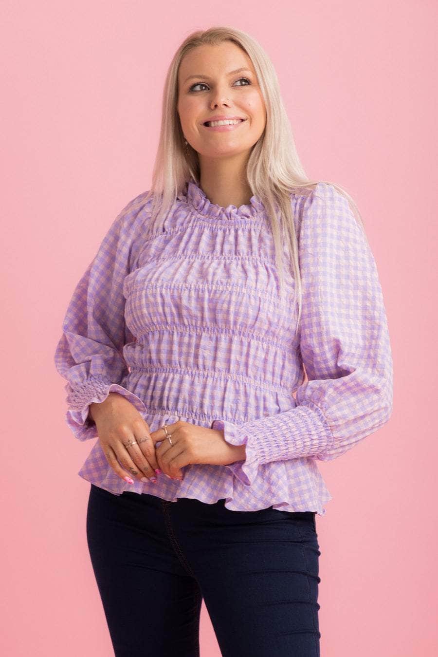 A lilac gingham print top with shirred seams