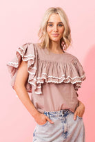 beige brown tan top with layers of gathered frills white trim ric rac