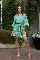 green and white mini dress