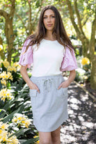 white top pink sleeves