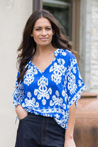blue and white print shirt