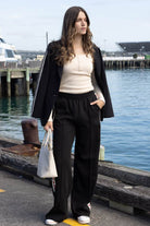 black wide leg pant with red hearts side stripes