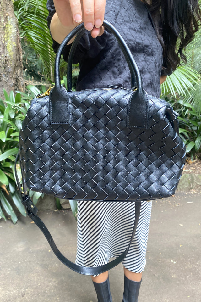 Black woven handbag with shoulder strap