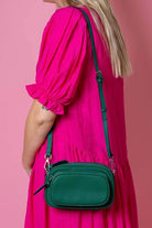 green leather handbag