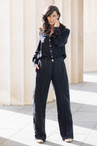 black pants brown stitching