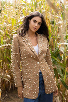 tan blazer with pearls