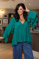 teal ruffle blouse