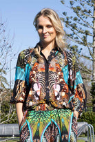 vibrant, multicolored butterfly-patterned button-up shirt