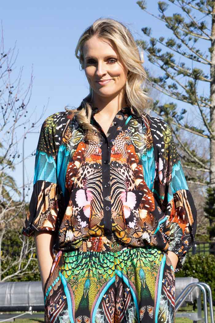 vibrant, multicolored butterfly-patterned button-up shirt