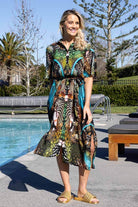 short-sleeve, button-front midi dress with a vibrant abstract print in green, teal, black, and brown