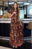 brown maxi skirt with a colorful botanical pattern