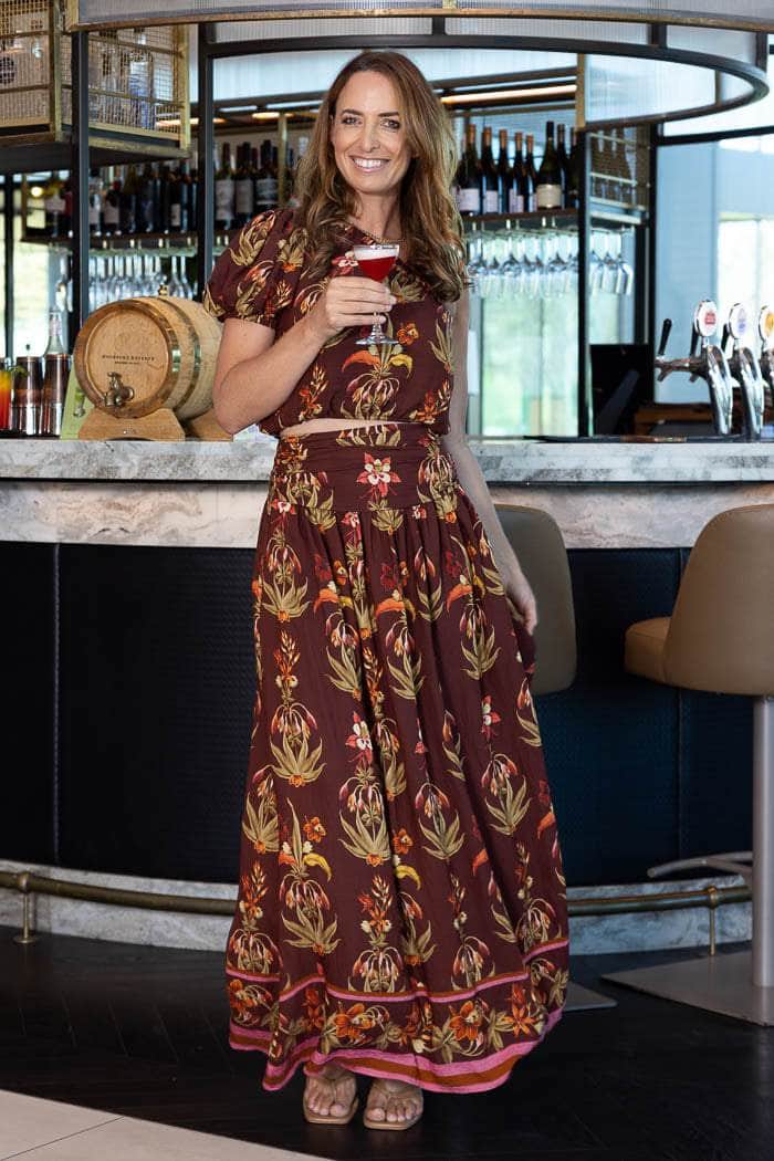brown maxi skirt with a colorful botanical pattern