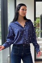 navy shirt with white heart embroidery