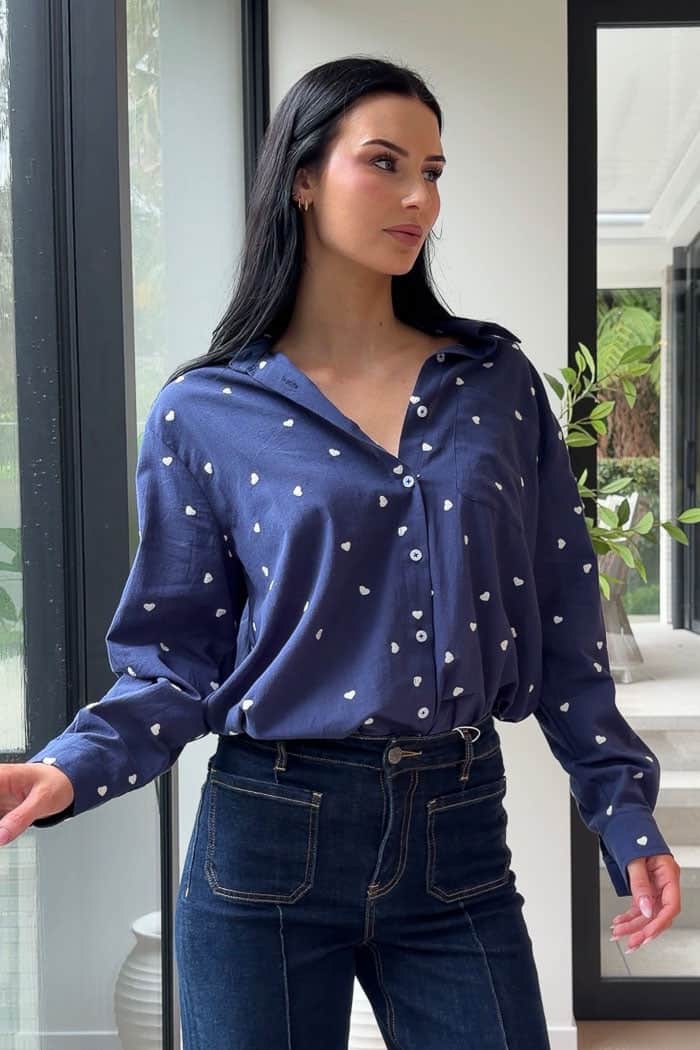 navy shirt with white heart embroidery