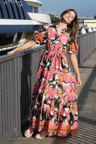 Woman in a colorful floral dress.