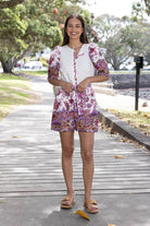 White and purple floral playsuit