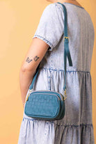 small blue leather handbag