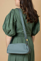 green leather handbag