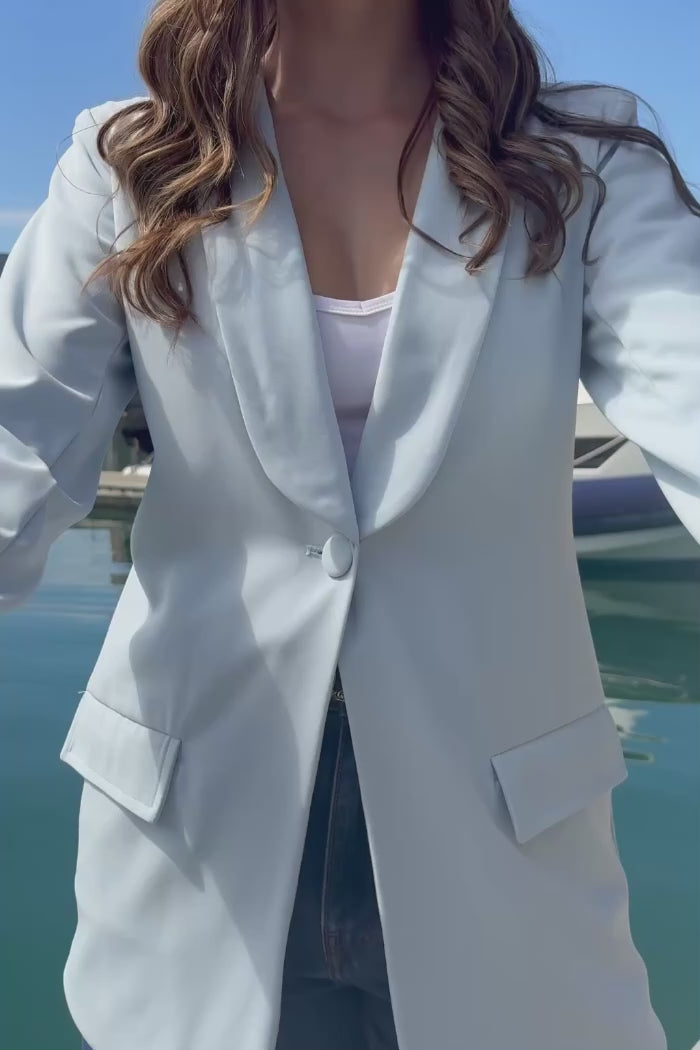 light blue blazer with a floral print detail on the cuffs