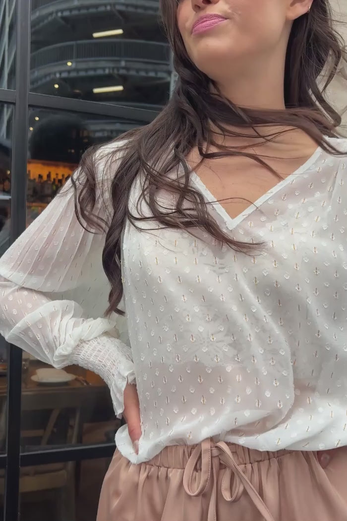 white blouse with gold pinstripe
