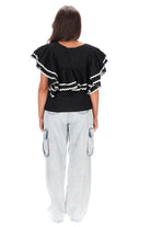 black top with layers of gathered frills white trim ric rac