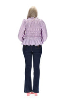 A lilac gingham print top with shirred seams