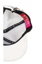 white sports cap with black logo